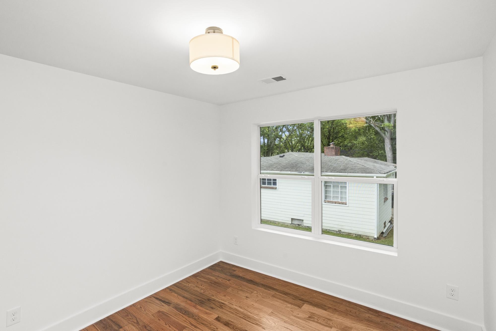 507 Demoss Street, Unit 110 Gallatin, TN 37066 - Photo 16 of 27 a view of a small space with wooden floor and a window