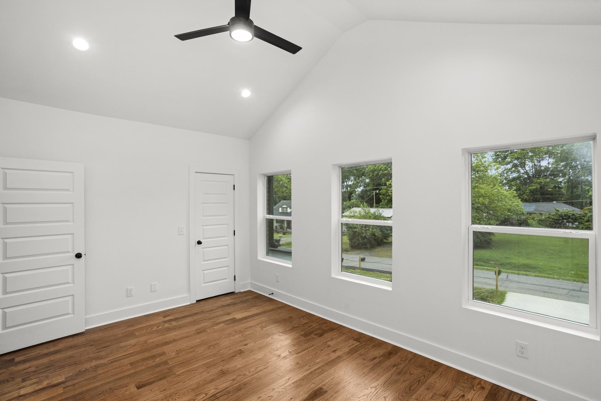 507 Demoss Street, Unit 110 Gallatin, TN 37066 - Photo 17 of 27 an empty room with wooden floor and windows