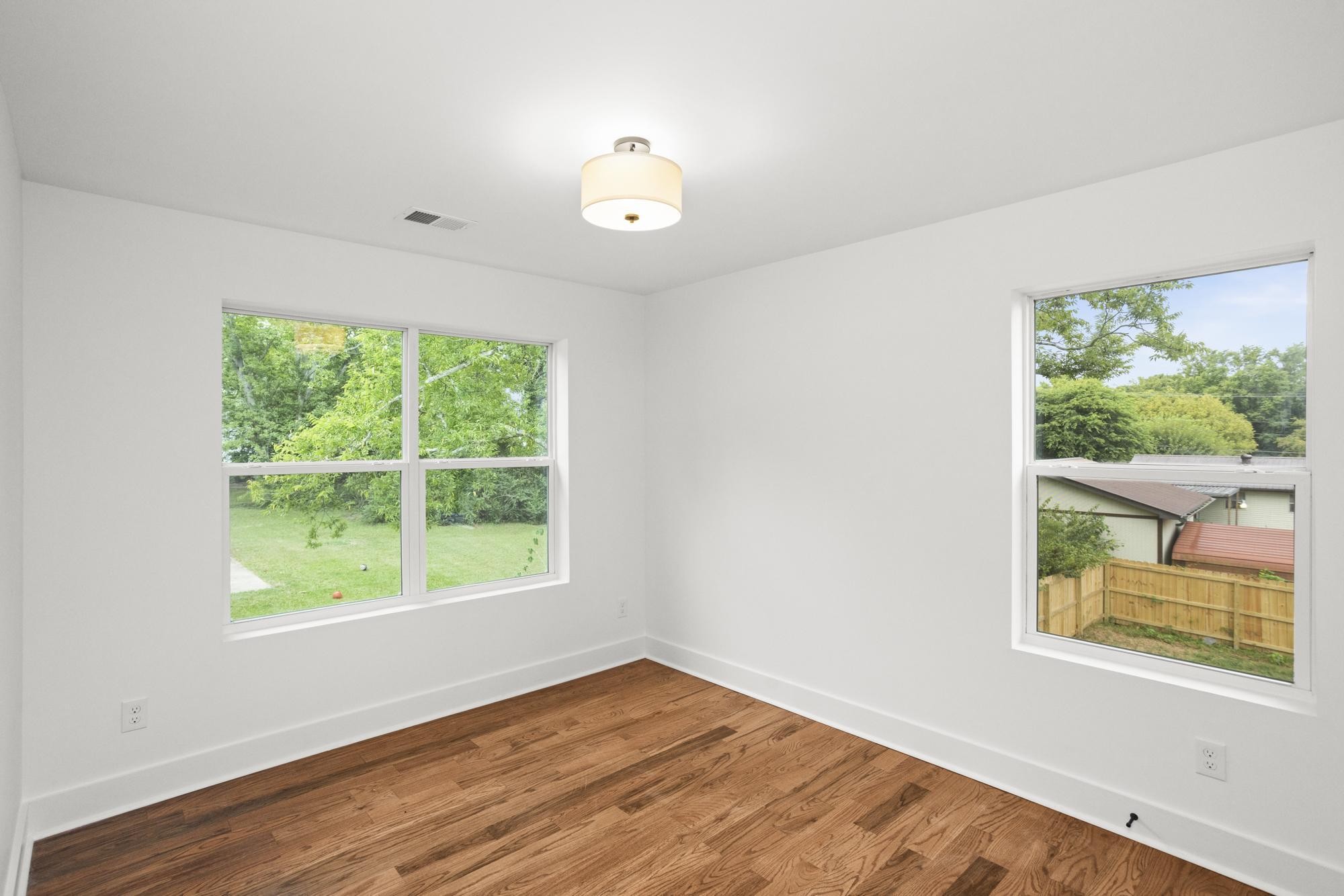 507 Demoss Street, Unit 110 Gallatin, TN 37066 - Photo 27 of 27 a view of an empty room with wooden floor and a window