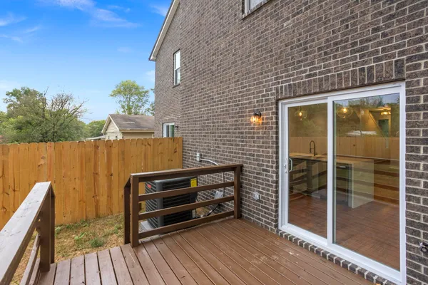 a view of outdoor space with wooden floor