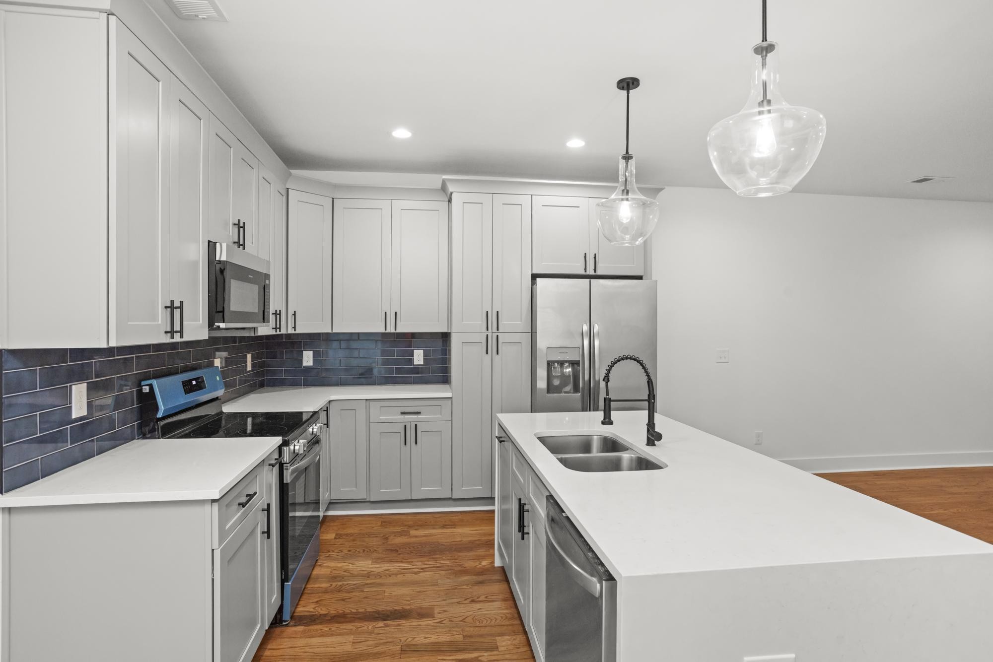 507 Demoss Street, Unit 110 Gallatin, TN 37066 - Photo 6 of 27 a kitchen with a sink stove and cabinets