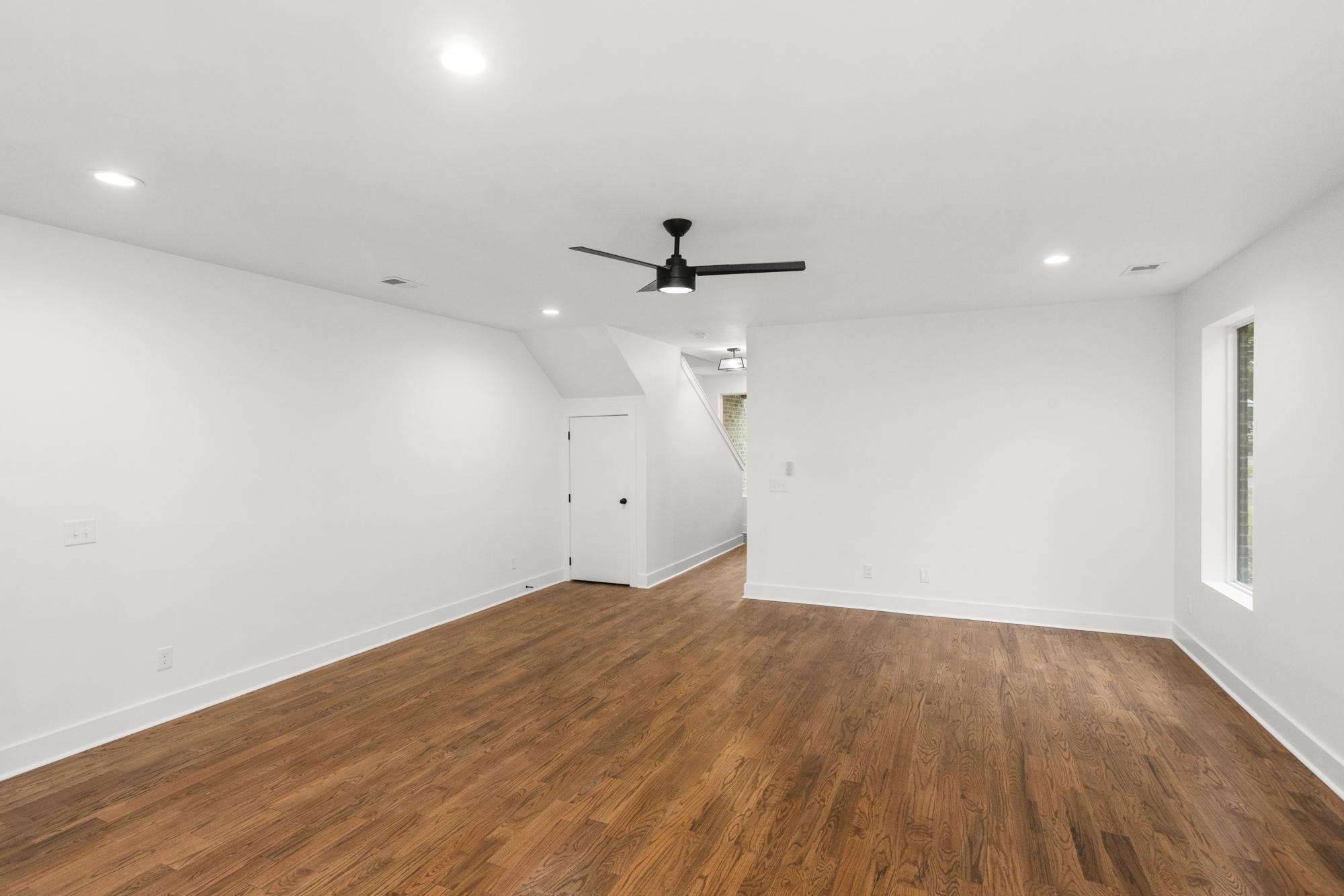 507 Demoss Street, Unit 110 Gallatin, TN 37066 - Photo 10 of 27 an empty room with wooden floor and ceiling fan