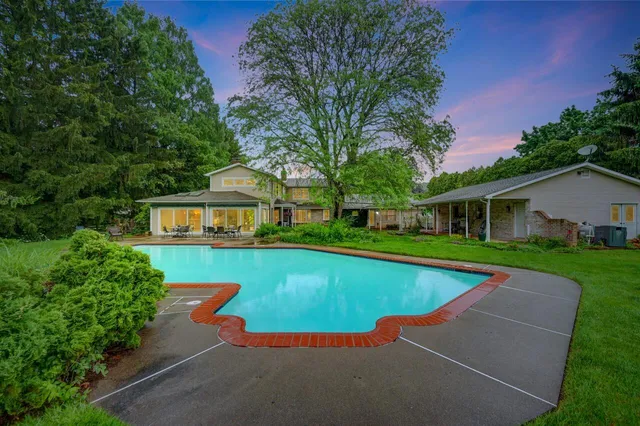a view of a house with a swimming pool