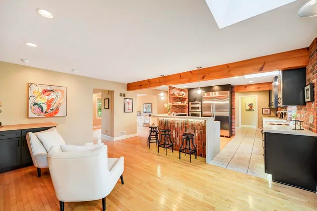 a kitchen with stainless steel appliances granite countertop a stove and a sink