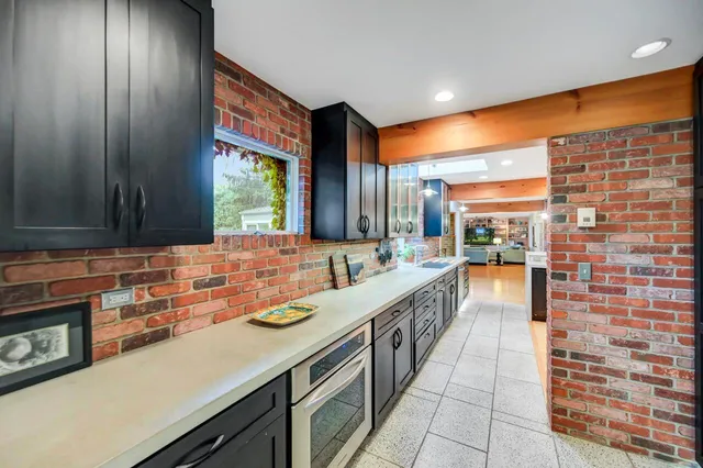 a view of a livingroom with furniture and a dining table