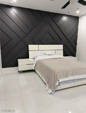 a bedroom with a bed and a night stand