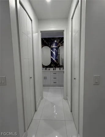 a bathroom with sinks mirror and vanity