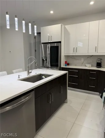 a kitchen with a sink and cabinets