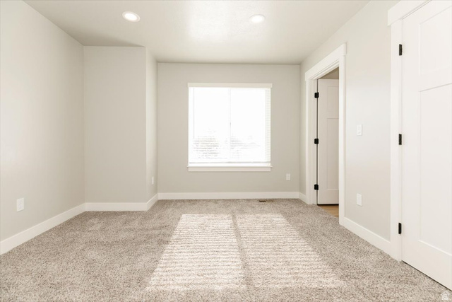 226 South 600 West Logan, UT 84321 - Photo 17 of 25 Unfurnished bedroom with light colored carpet and recessed lighting