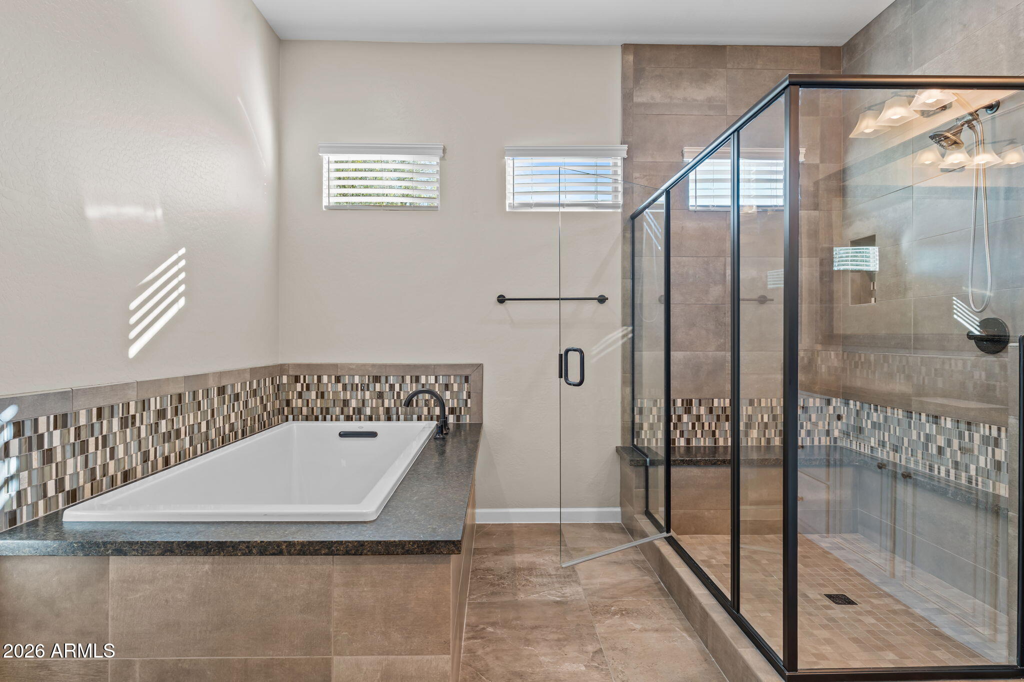 3675 Gold Ridge Road Wickenburg, AZ 85390 - Photo 23 of 58 a bathroom with a tub and shower