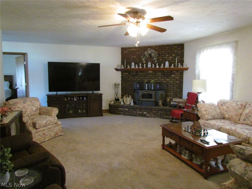 10174 Veto Road Belpre, OH 45714 - Photo 21 of 45 Living room with decorative fireplace.
