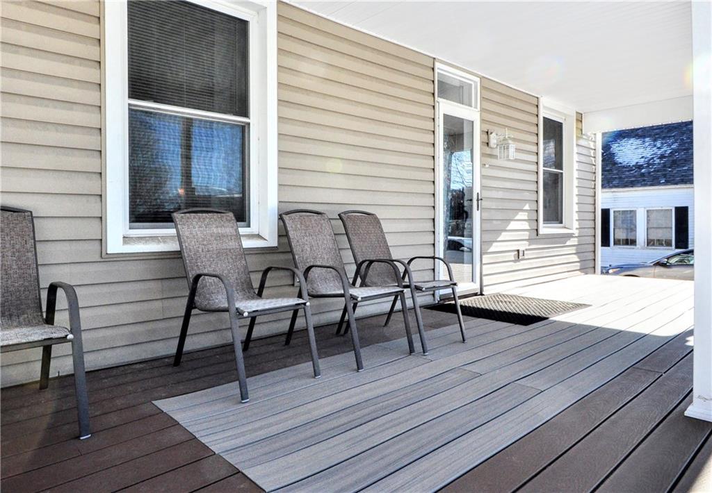 104 Navy Street Perryopolis, PA 15473 - Photo 4 of 45 a view of a roof deck with table and chairs with wooden floor
