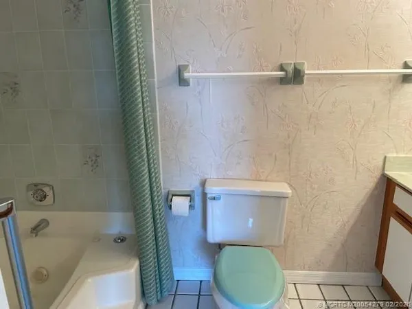 a bathroom with a bathtub and a toilet