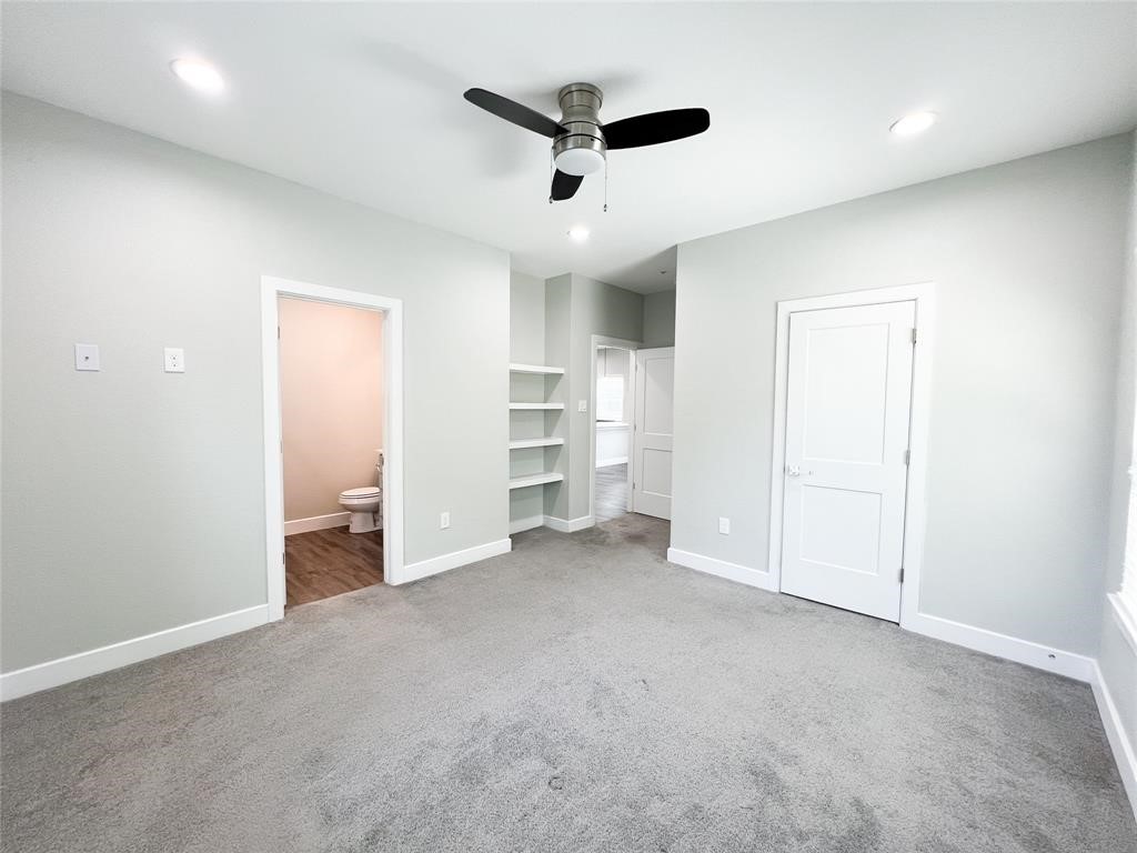 144 West 5th Street, Unit B Kemah, TX 77565 - Photo 12 of 22 an empty room with a ceiling fan
