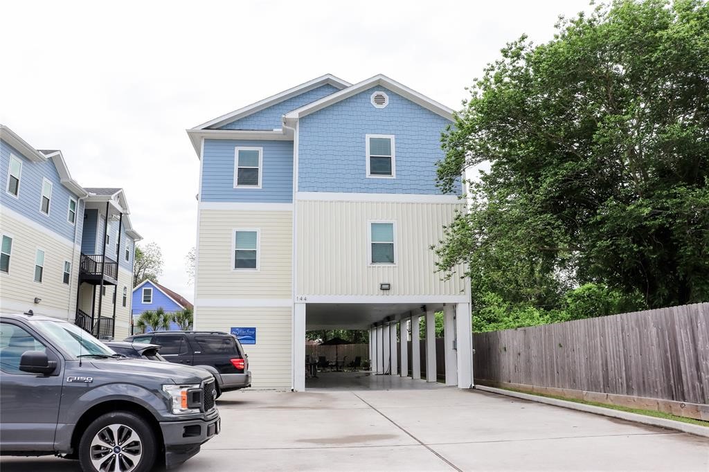 144 West 5th Street, Unit B Kemah, TX 77565 - Photo 2 of 22 a front view of a house with a garage