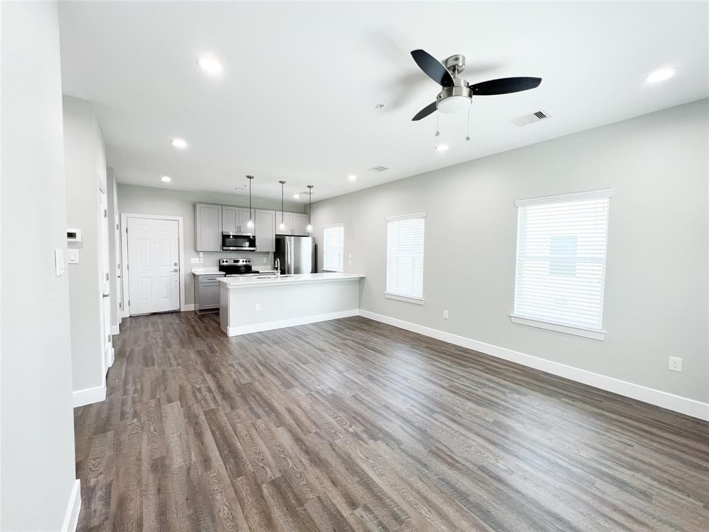 144 West 5th Street, Unit B Kemah, TX 77565 - Photo 10 of 22 a view of kitchen with sink and wooden floor