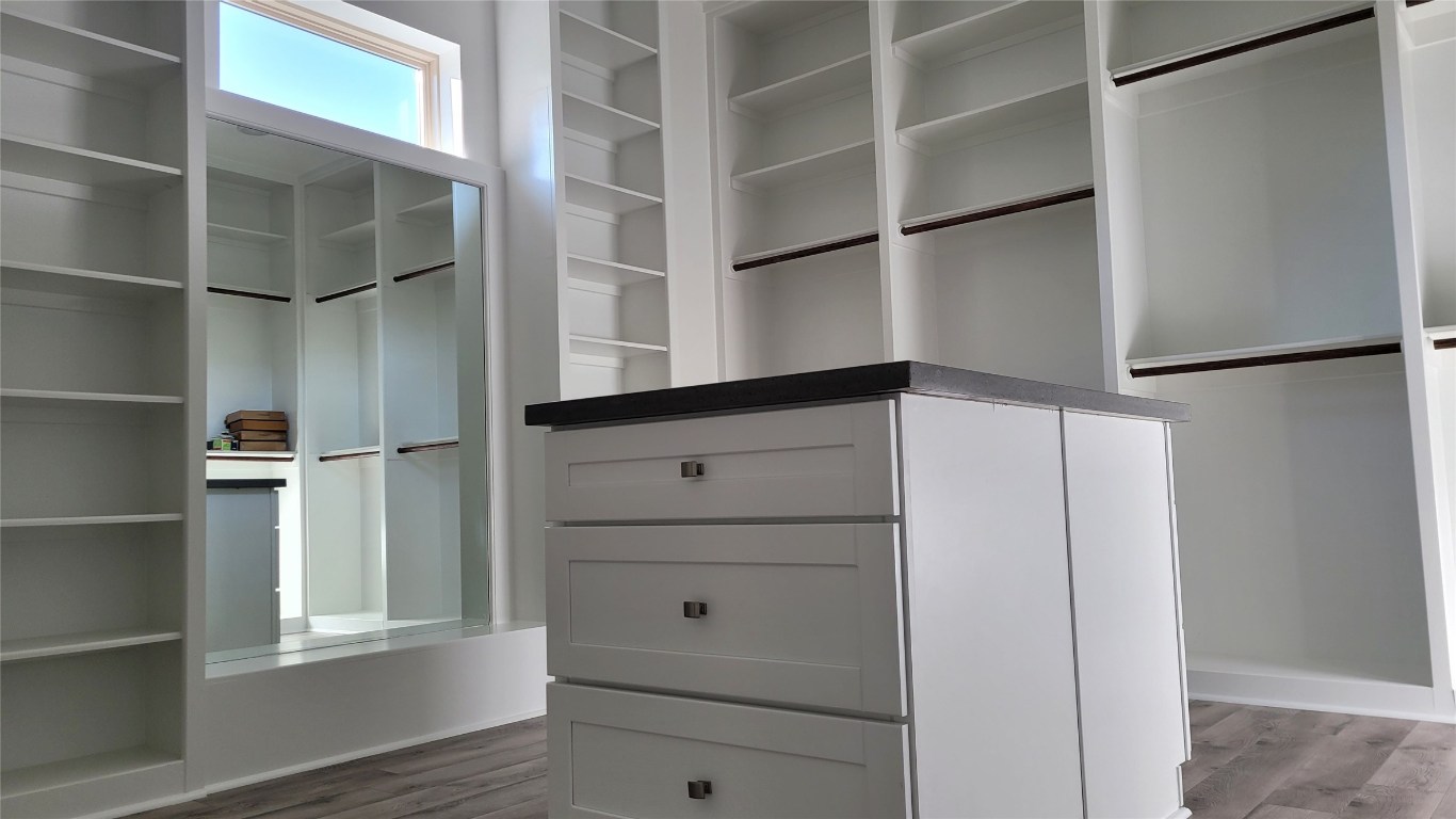 9729 Neuens Road Houston, TX 77080 - Photo 29 of 34 a view of walk in closet with empty racks