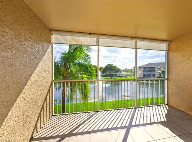 a view of a balcony with lake and outdoor space