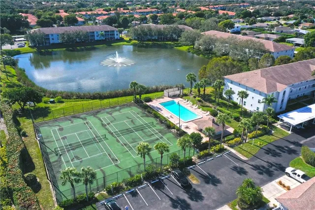 an aerial view of a house with a lake view