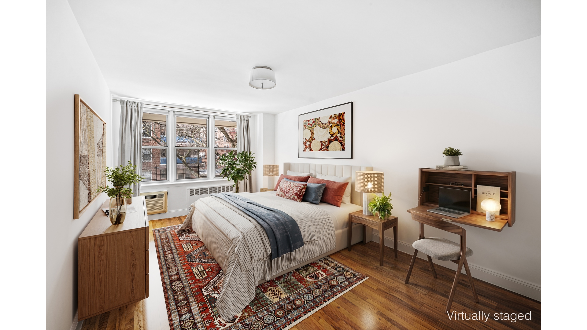 415 Argyle Road, Unit 2/3L Brooklyn, NY 11218 - Photo 12 of 23 a bedroom with a bed a bookshelf a chair and a stove next to a window