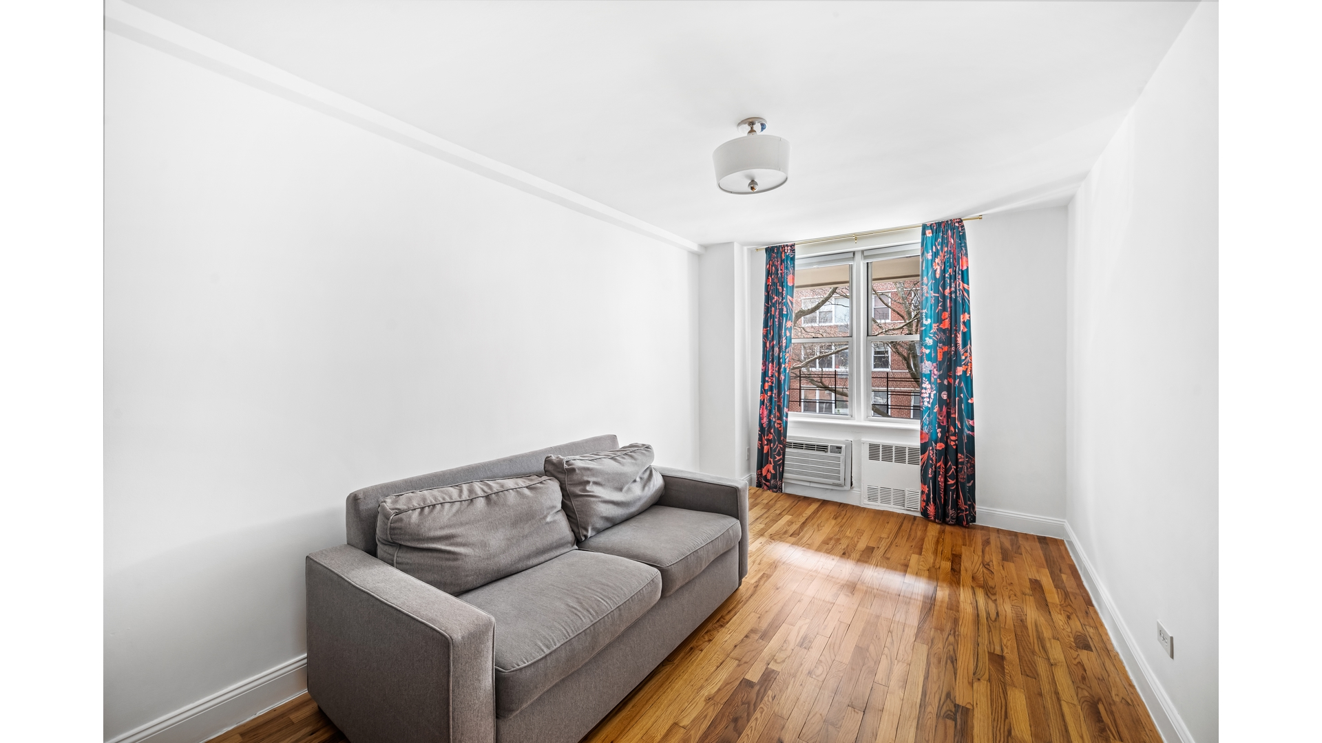 415 Argyle Road, Unit 2/3L Brooklyn, NY 11218 - Photo 16 of 23 a living room with furniture and a wooden floor