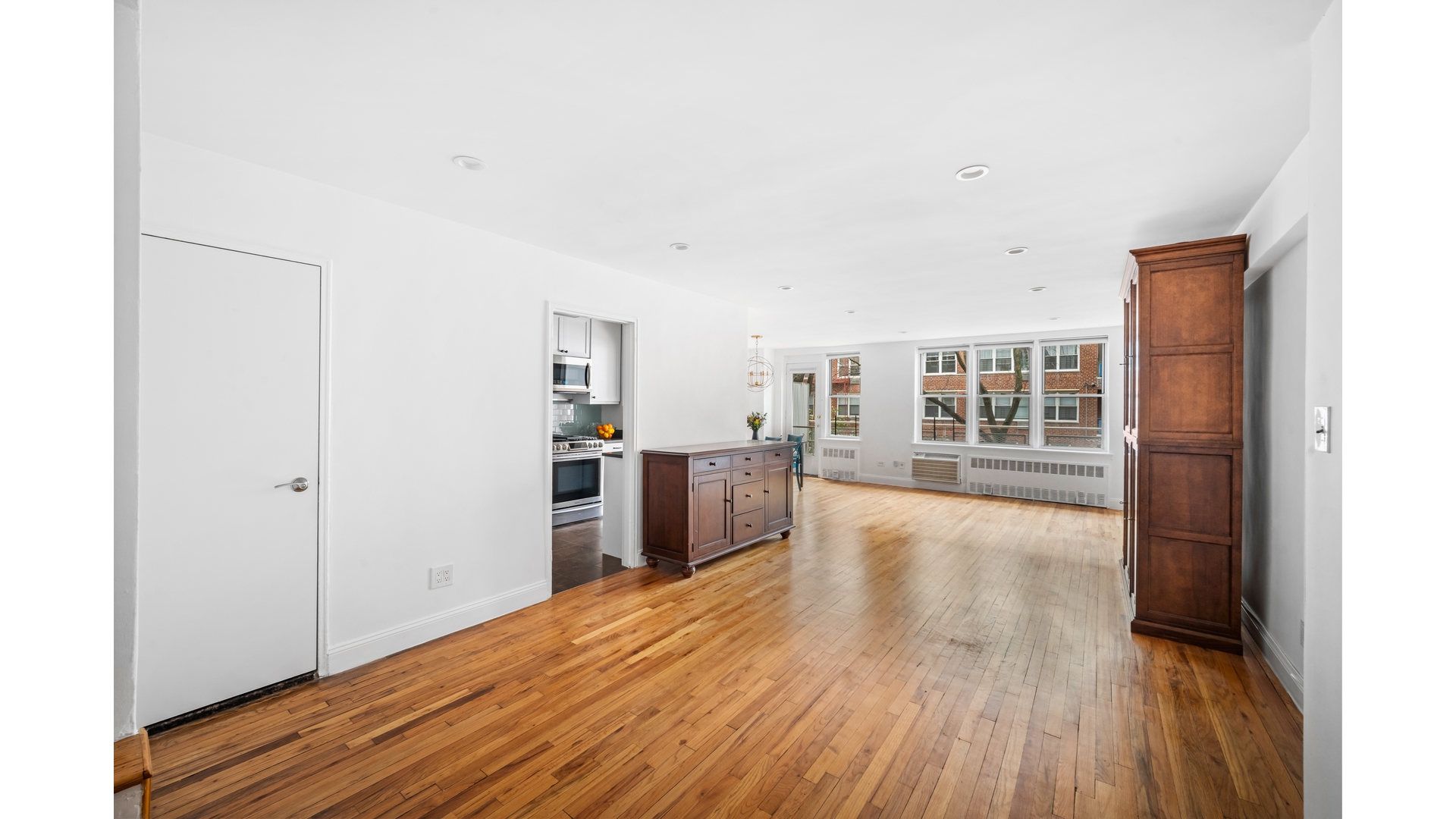 415 Argyle Road, Unit 2/3L Brooklyn, NY 11218 - Photo 4 of 23 a view of a kitchen with wooden floor and a window