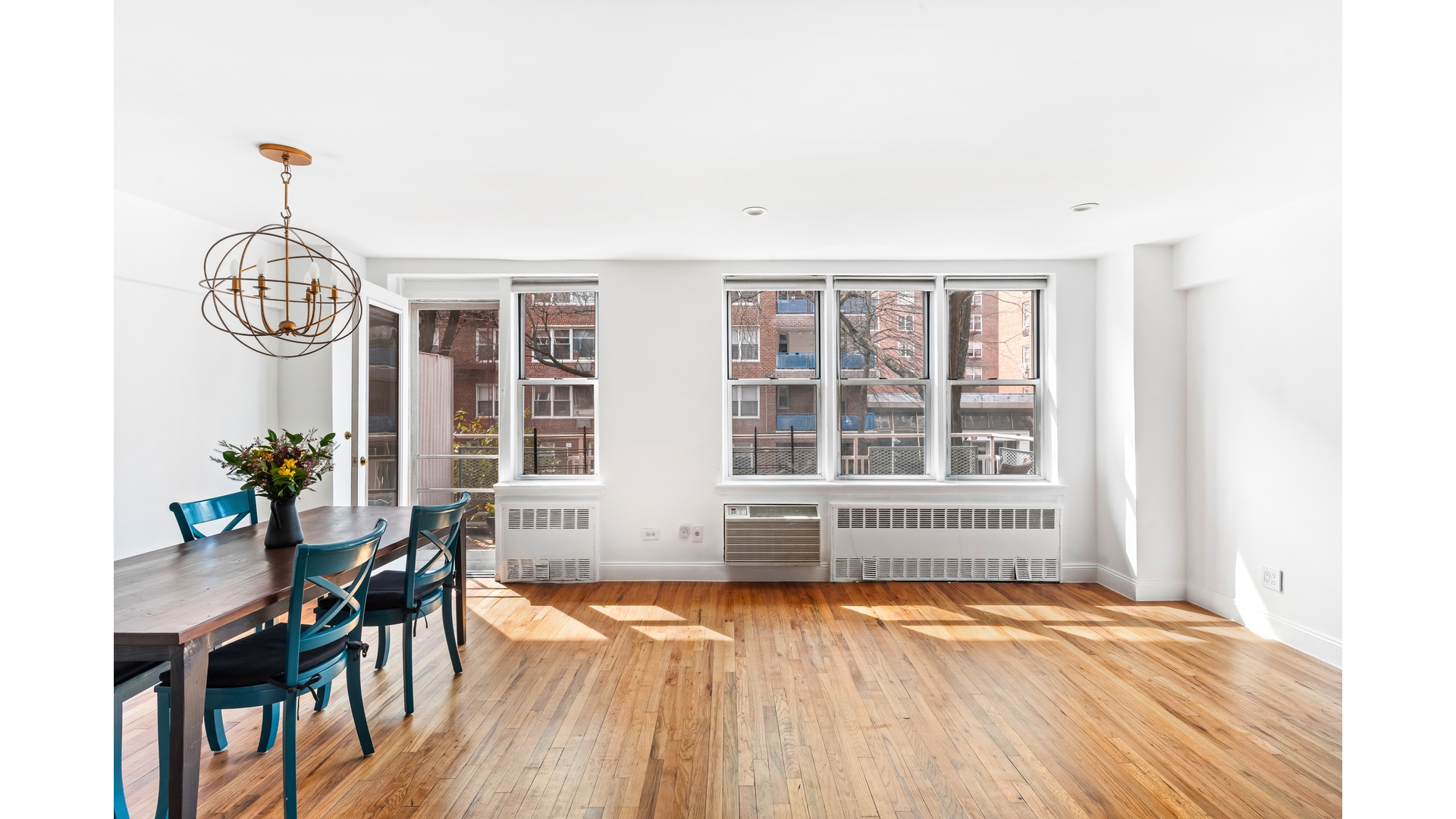 415 Argyle Road, Unit 2/3L Brooklyn, NY 11218 - Photo 6 of 23 an empty room with wooden floor and windows
