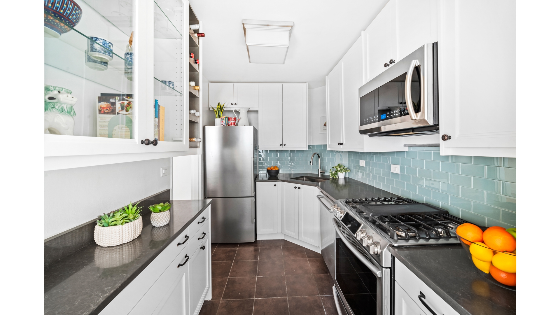 415 Argyle Road, Unit 2/3L Brooklyn, NY 11218 - Photo 8 of 23 a kitchen with stainless steel appliances granite countertop a lot of cabinets and a stove