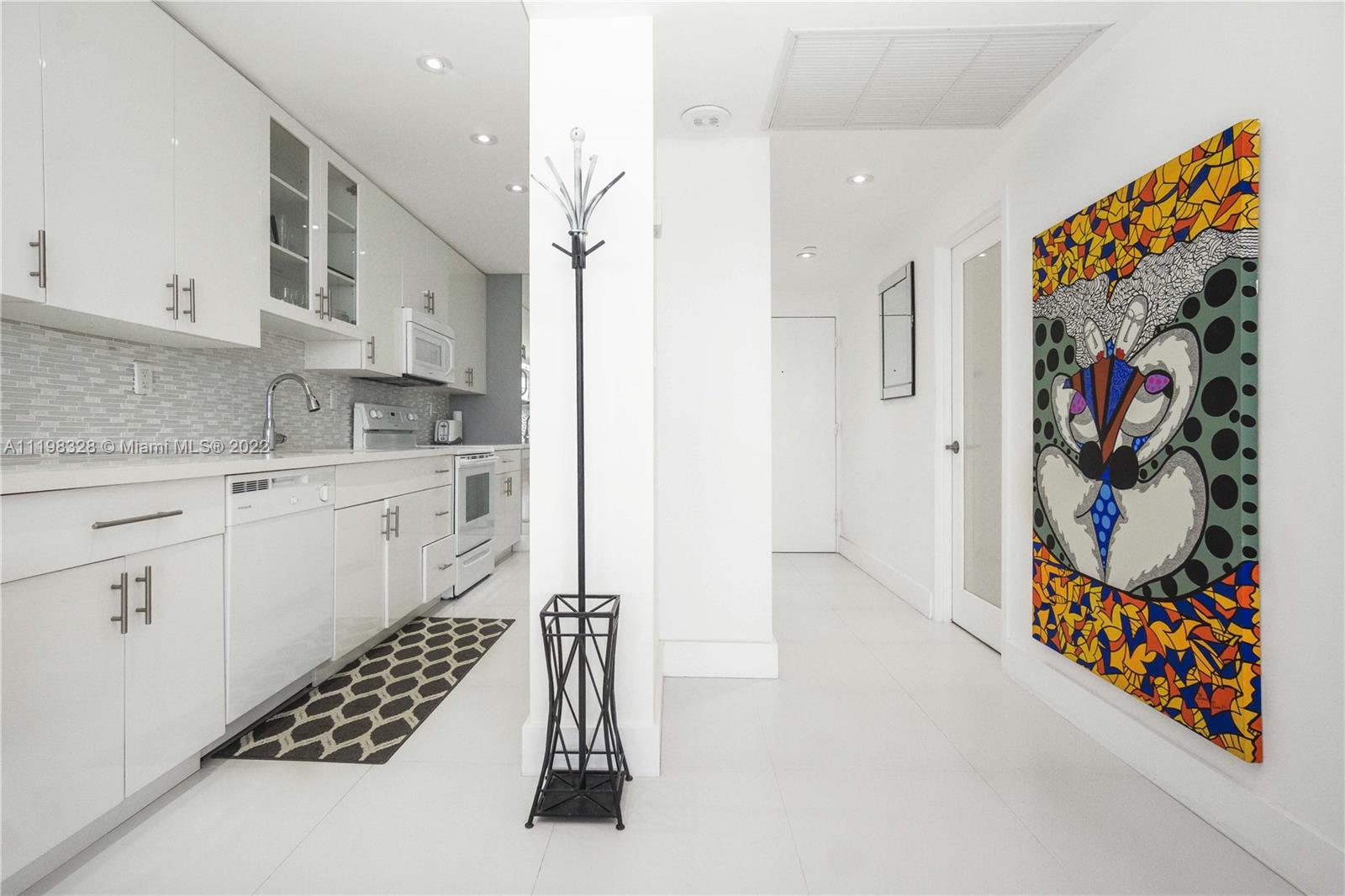 100 Lincoln Road, Unit 646 Miami Beach, FL 33139 - Photo 11 of 21 a kitchen with stainless steel appliances a refrigerator and a sink