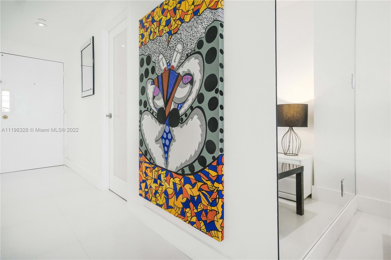 100 Lincoln Road, Unit 646 Miami Beach, FL 33139 - Photo 12 of 21 a bathroom with a painting on the wall and a shower