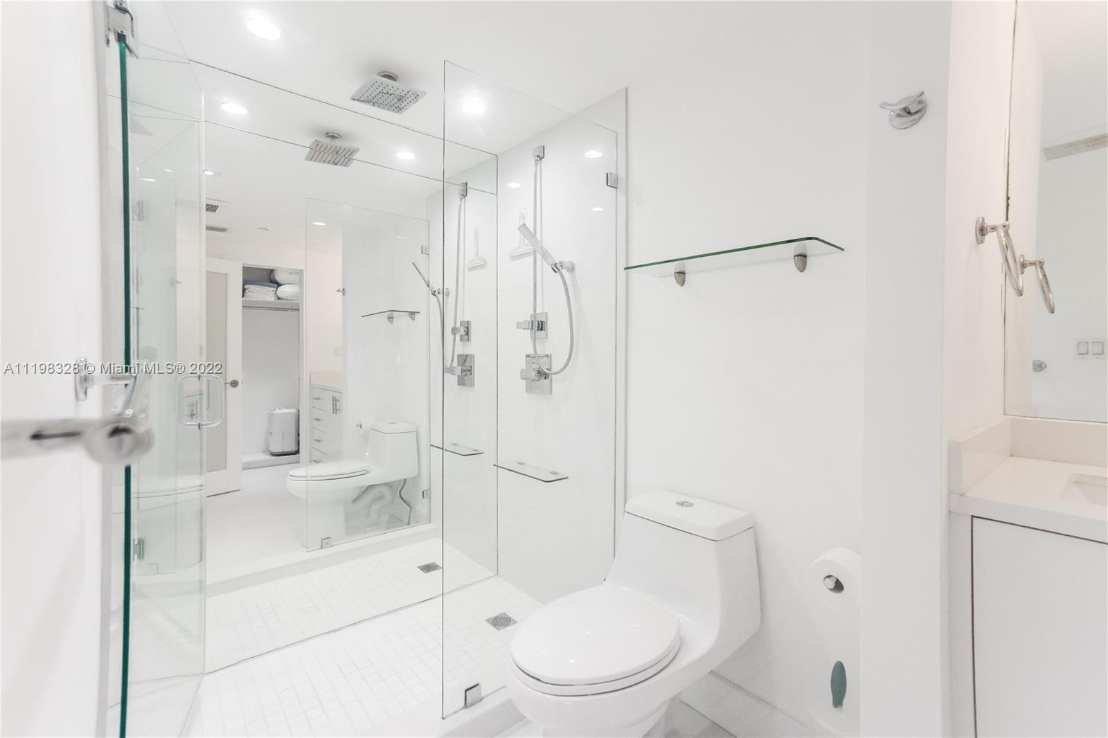 100 Lincoln Road, Unit 646 Miami Beach, FL 33139 - Photo 15 of 21 a bathroom with a granite countertop sink toilet and shower