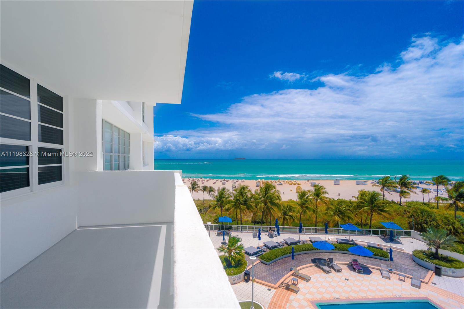 100 Lincoln Road, Unit 646 Miami Beach, FL 33139 - Photo 2 of 21 a view of swimming pool with seating area and green mountains in the background