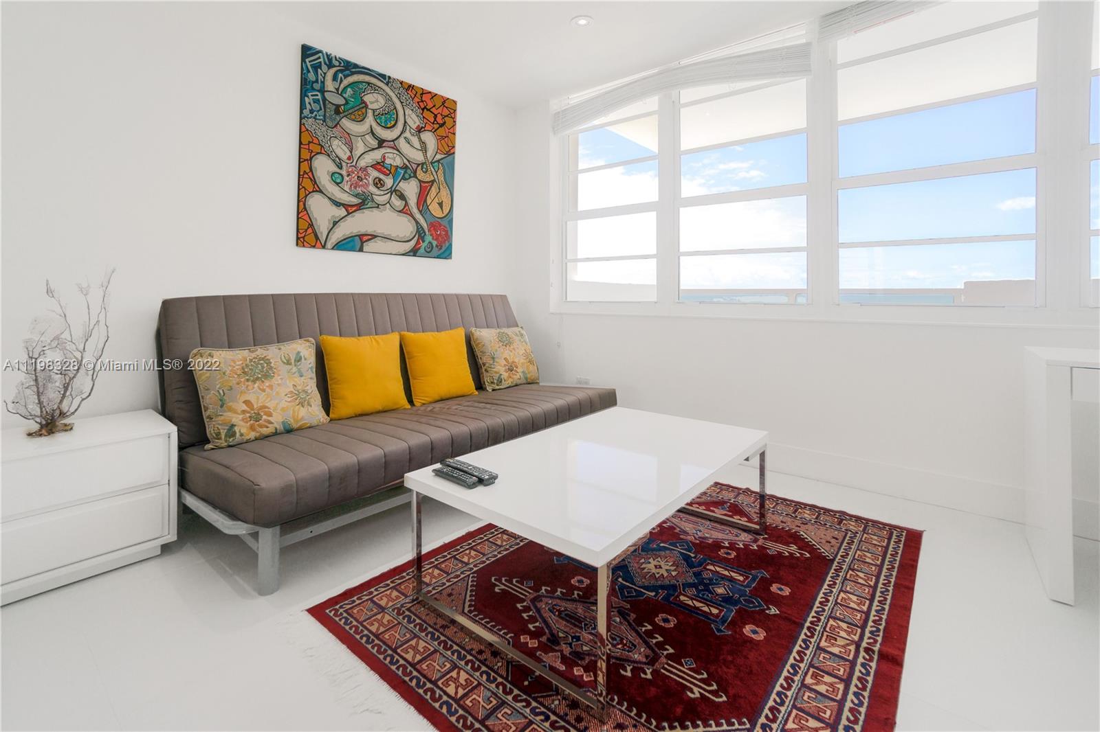 100 Lincoln Road, Unit 646 Miami Beach, FL 33139 - Photo 4 of 21 a living room with furniture and a window