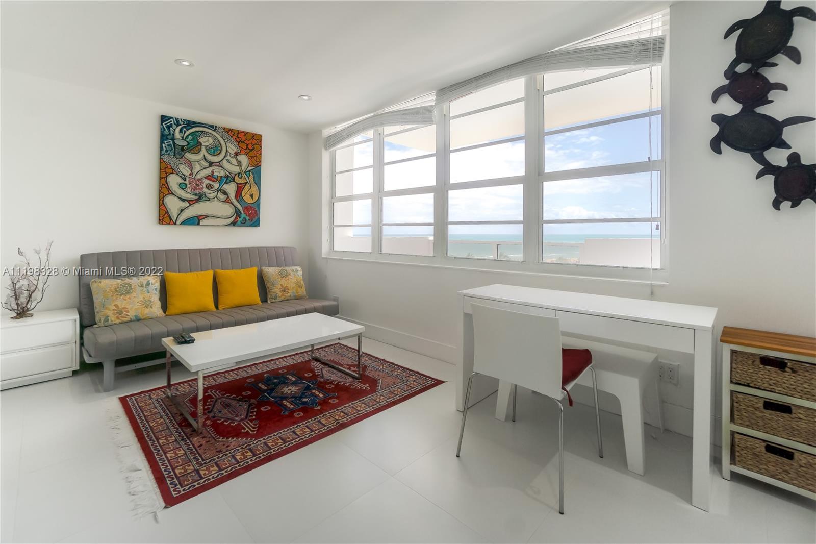 100 Lincoln Road, Unit 646 Miami Beach, FL 33139 - Photo 5 of 21 a living room with furniture and a window