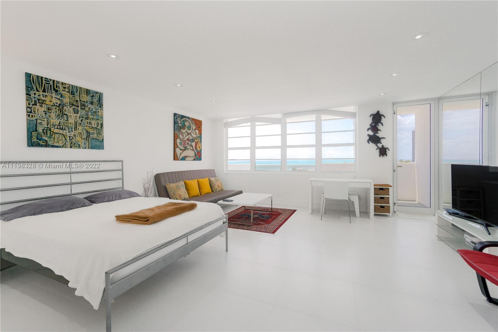 100 Lincoln Road, Unit 646 Miami Beach, FL 33139 - Photo 8 of 21 a bedroom with a bed and a tv