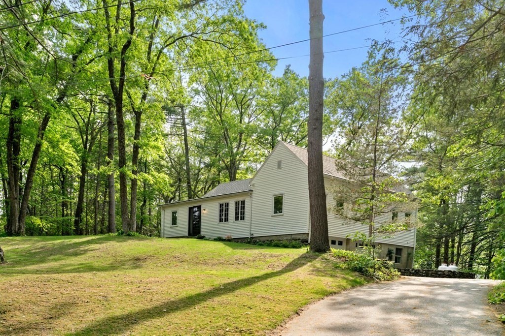 32 Whitman Road Harvard, MA 01451 - Photo 1 of 38 a front view of a house with a yard