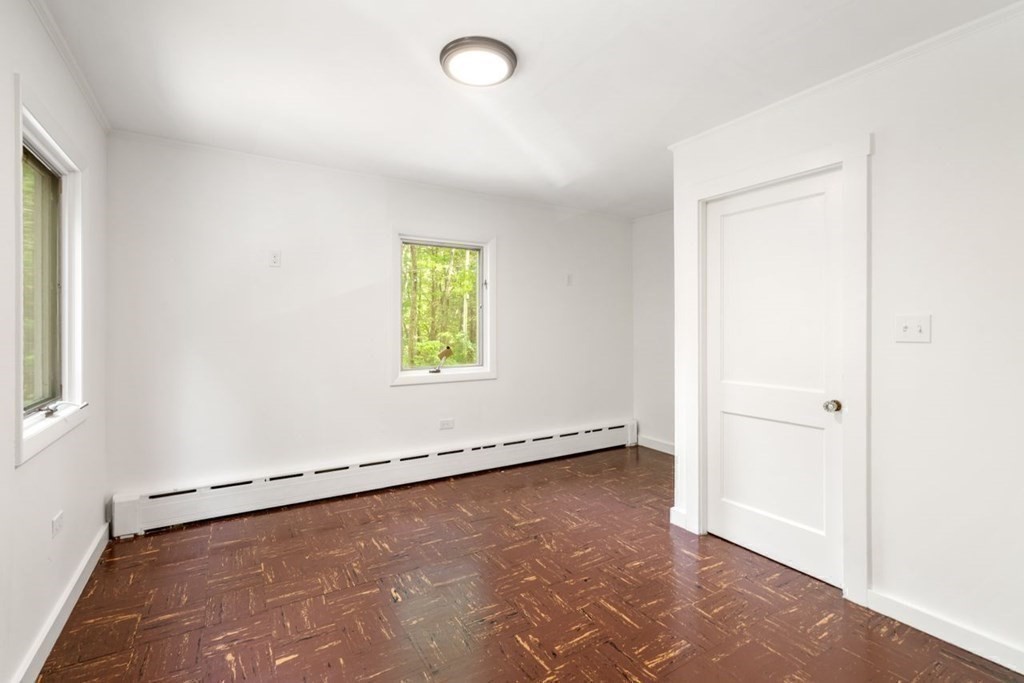 32 Whitman Road Harvard, MA 01451 - Photo 22 of 38 an empty room with a window and a refrigerator
