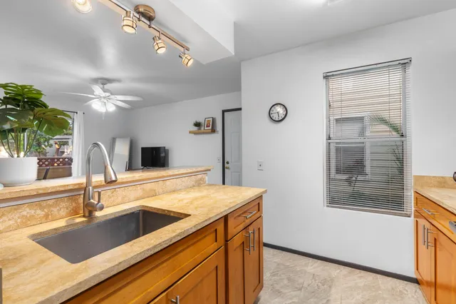 a kitchen with a sink and a window