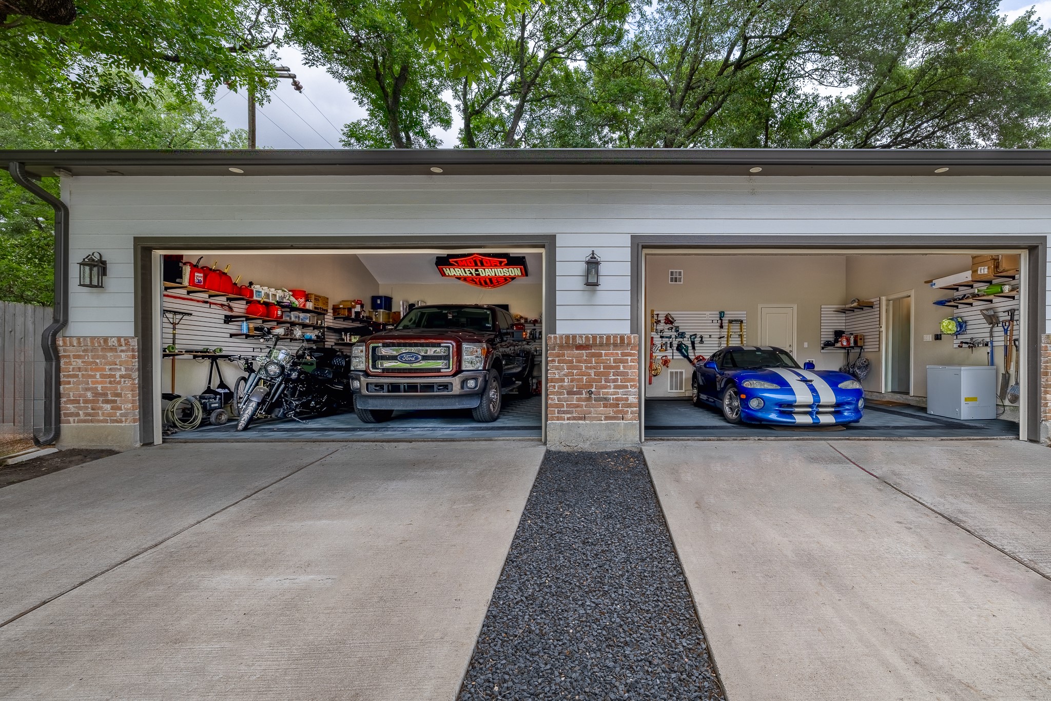 Stunning air-conditioned 4-car garage addition — 1,136 sq ft of climate-controlled space, perfect for car enthusiasts or additional storage