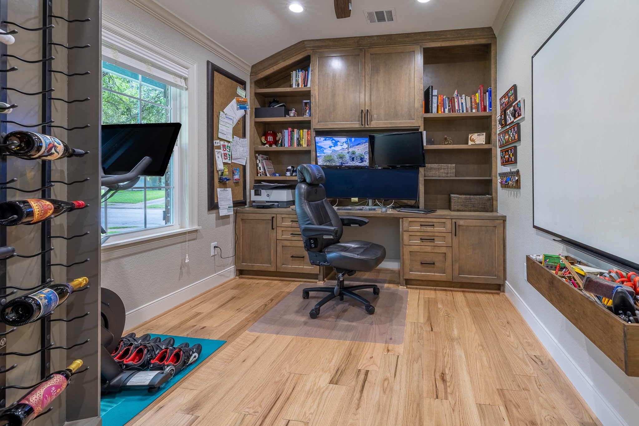 5230 Redstart Street Houston, TX 77035 - Photo 10 of 30 Private dedicated office with murphy door built-in shelving — the perfect work-from-home retreat