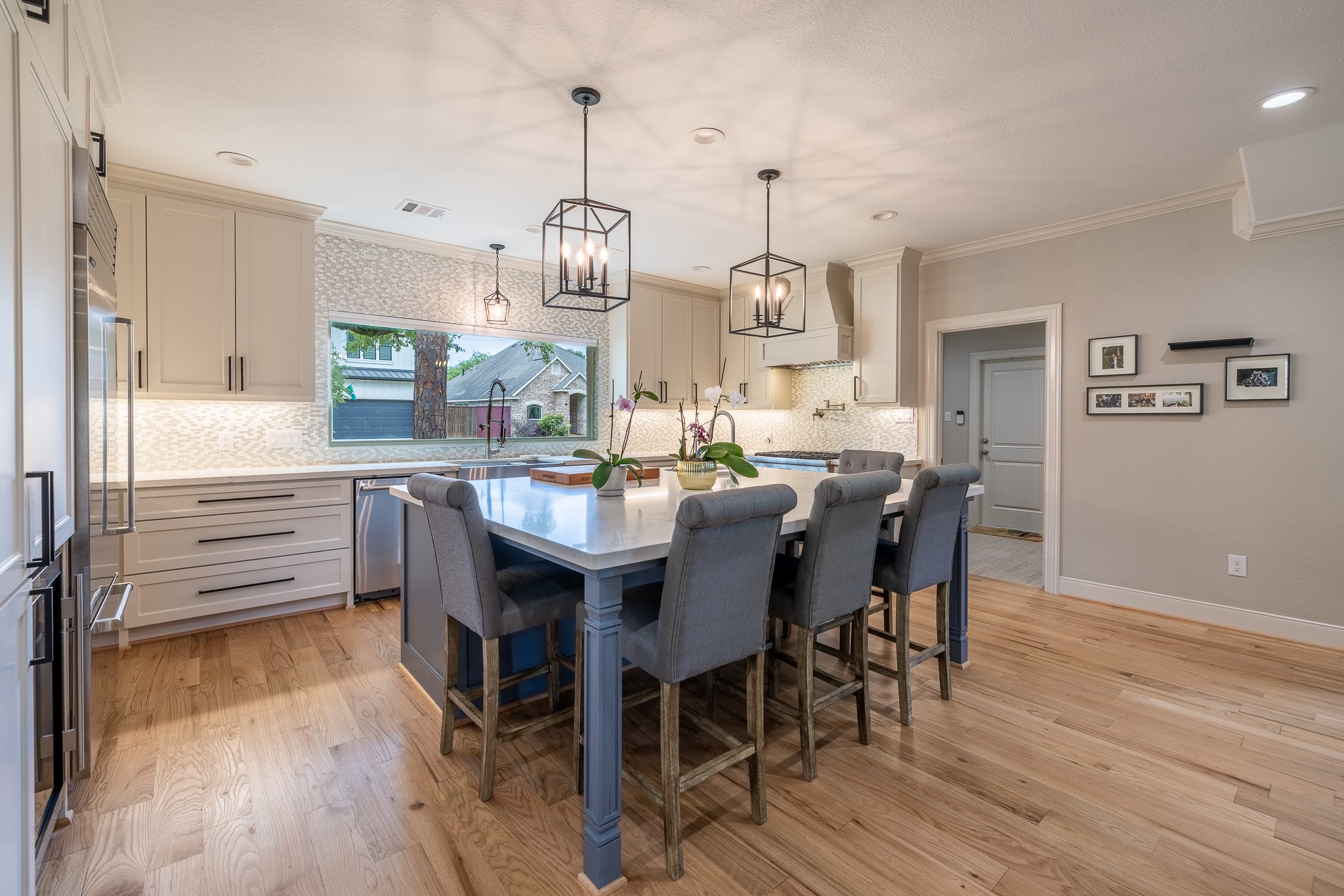 5230 Redstart Street Houston, TX 77035 - Photo 11 of 30 Open-concept kitchen with oversized island, designer pendant lighting, and premium cabinetry