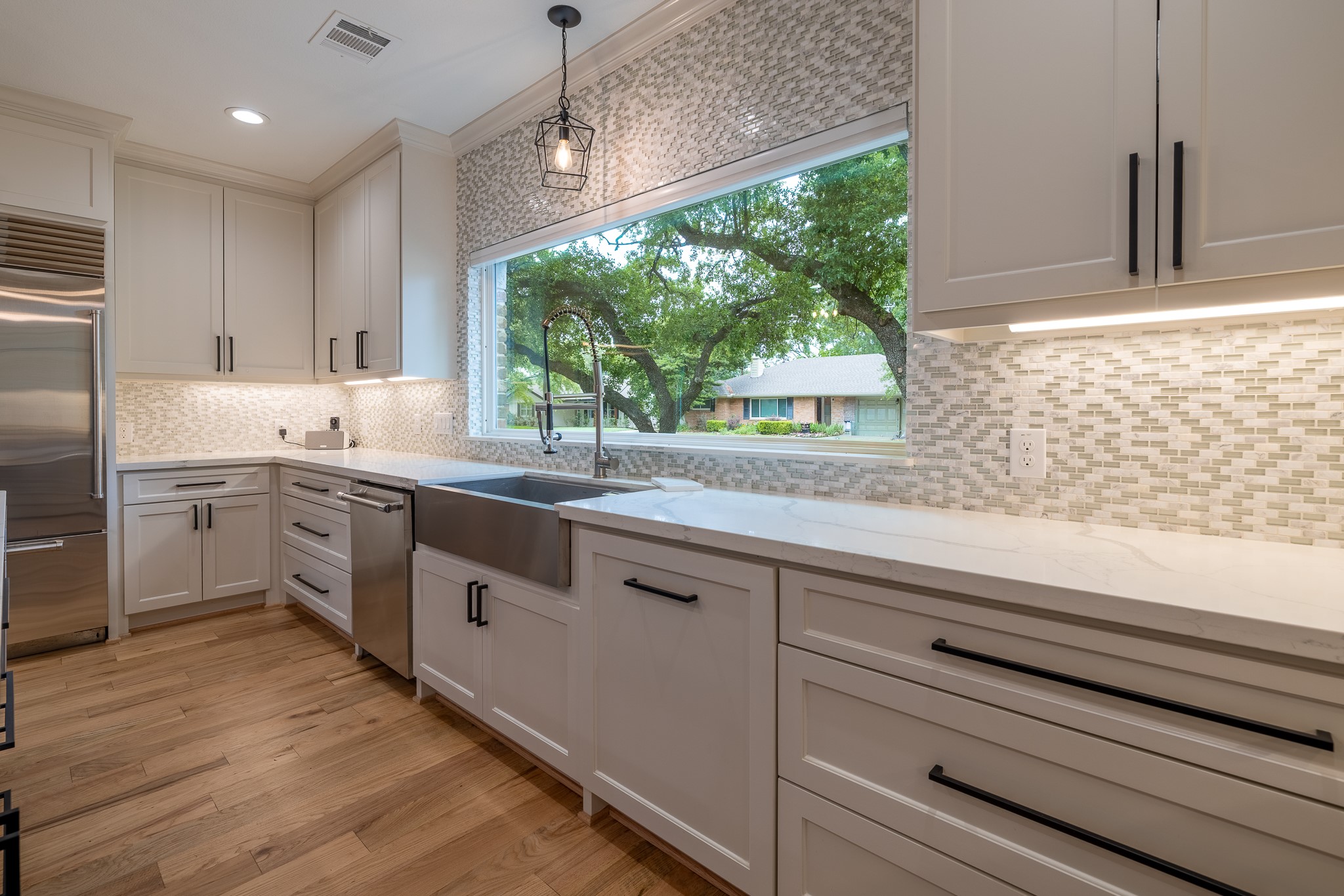 5230 Redstart Street Houston, TX 77035 - Photo 14 of 30 Kitchen detail — custom cabinetry, quartz countertops, and luxury finishes throughout