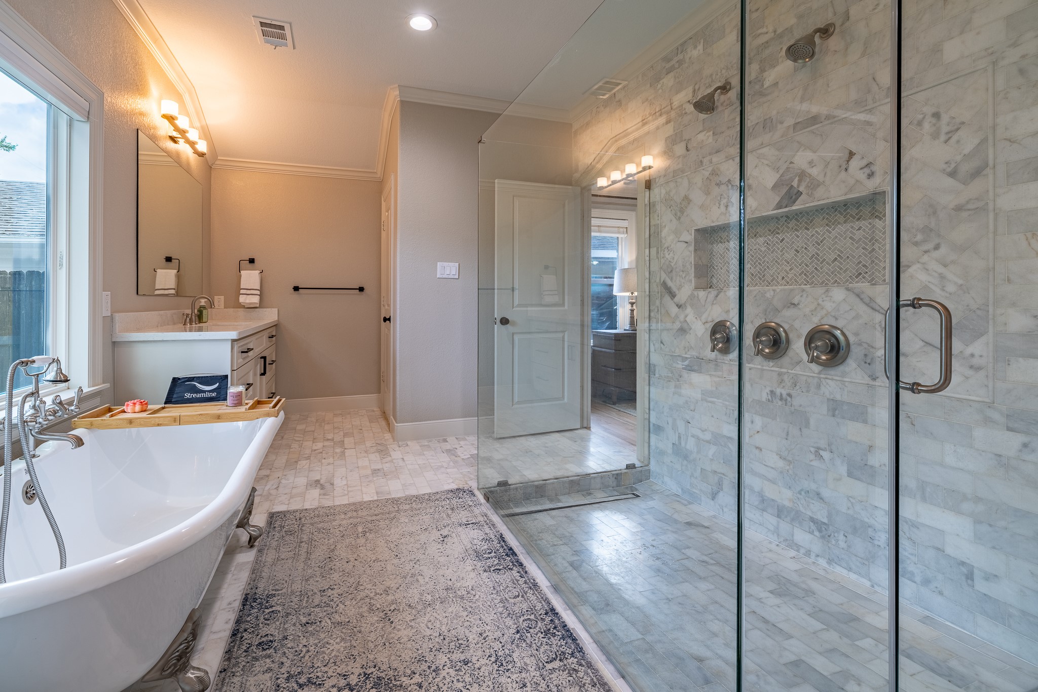 5230 Redstart Street Houston, TX 77035 - Photo 20 of 30 Spa-inspired primary bath with oversized walk-in shower and frameless glass enclosure