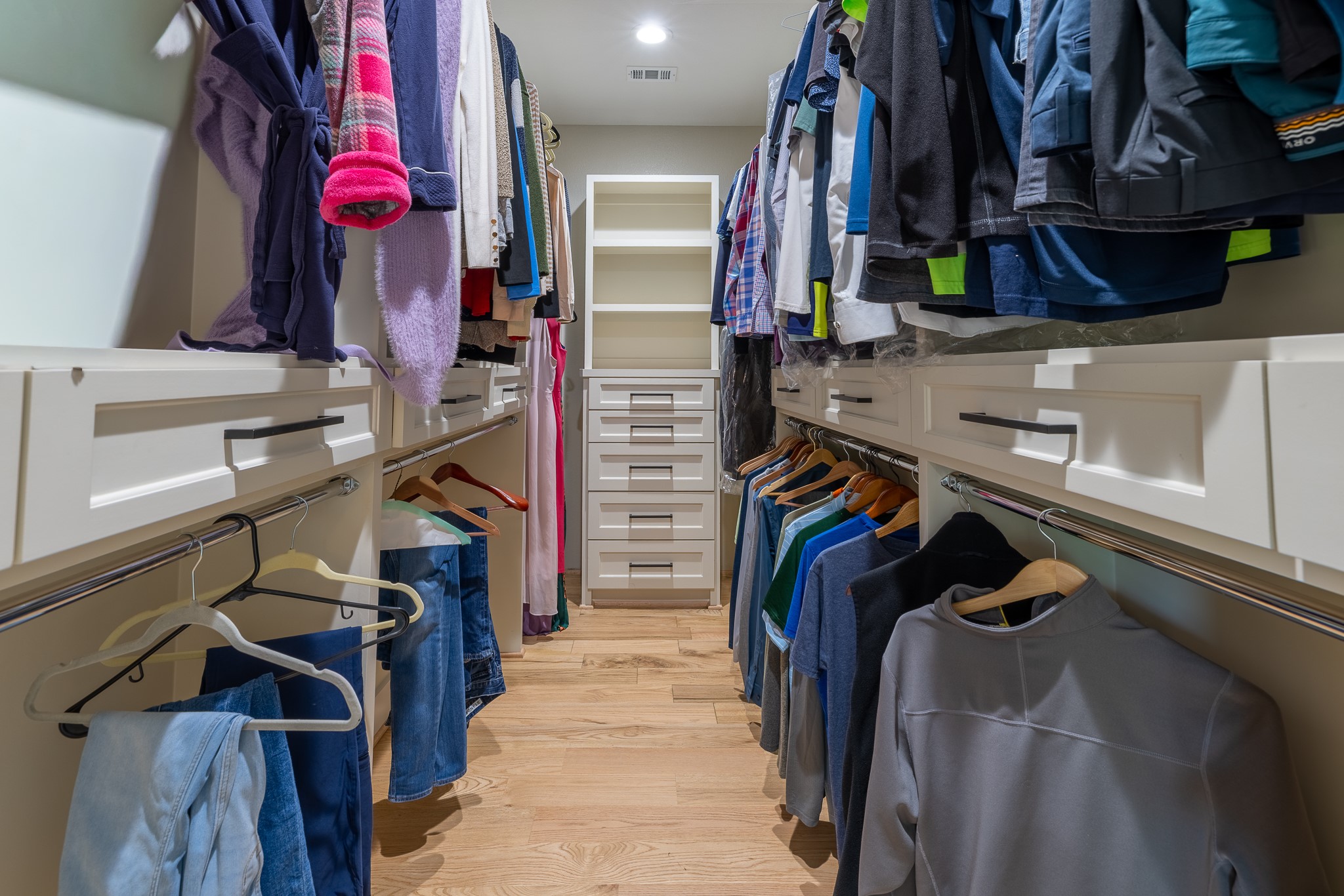 5230 Redstart Street Houston, TX 77035 - Photo 22 of 30 Expansive walk-in Primary closet with custom built-ins — organization made effortless
