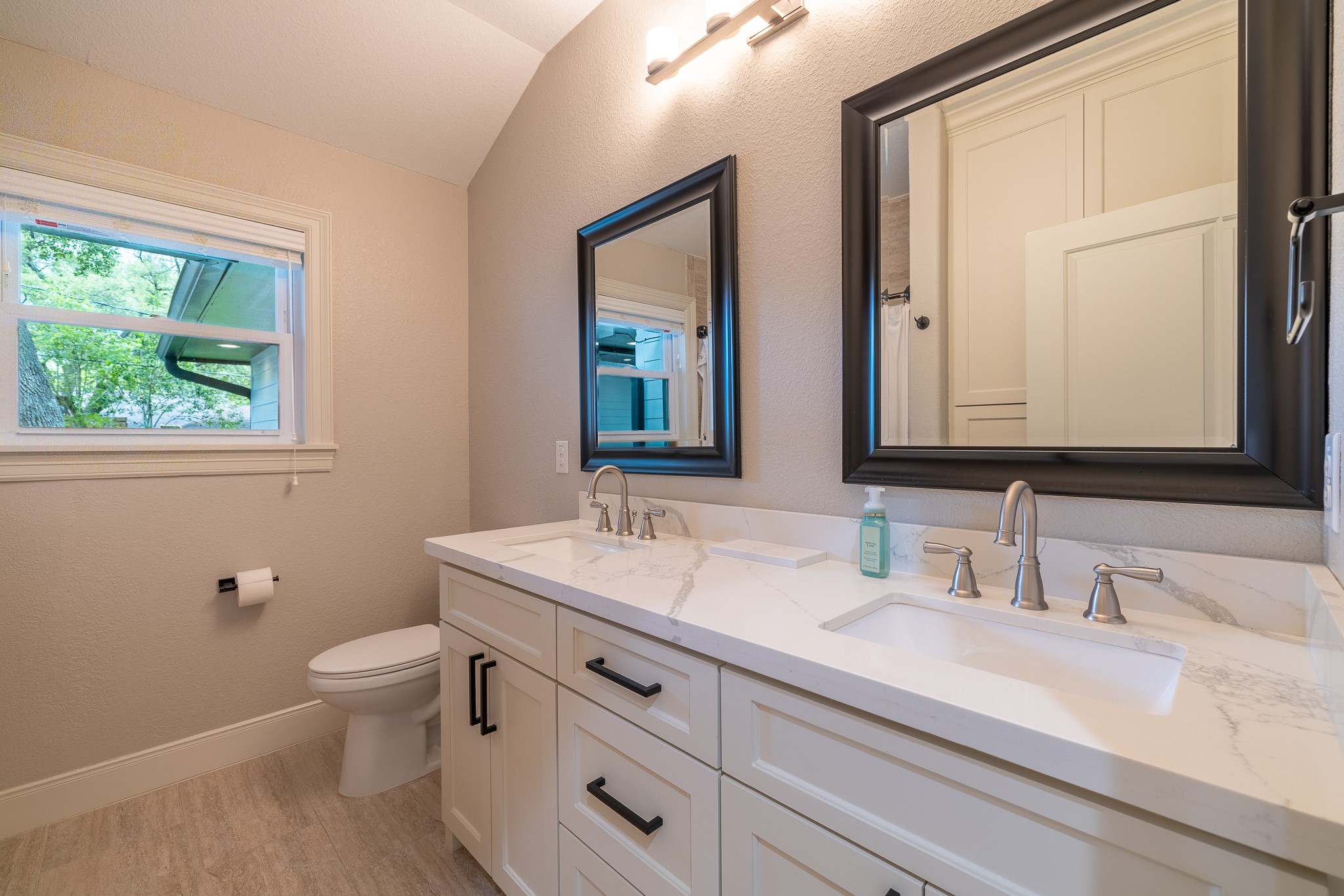 5230 Redstart Street Houston, TX 77035 - Photo 25 of 30 Secondary bath with soaking tub, designer tile, and custom vanity
