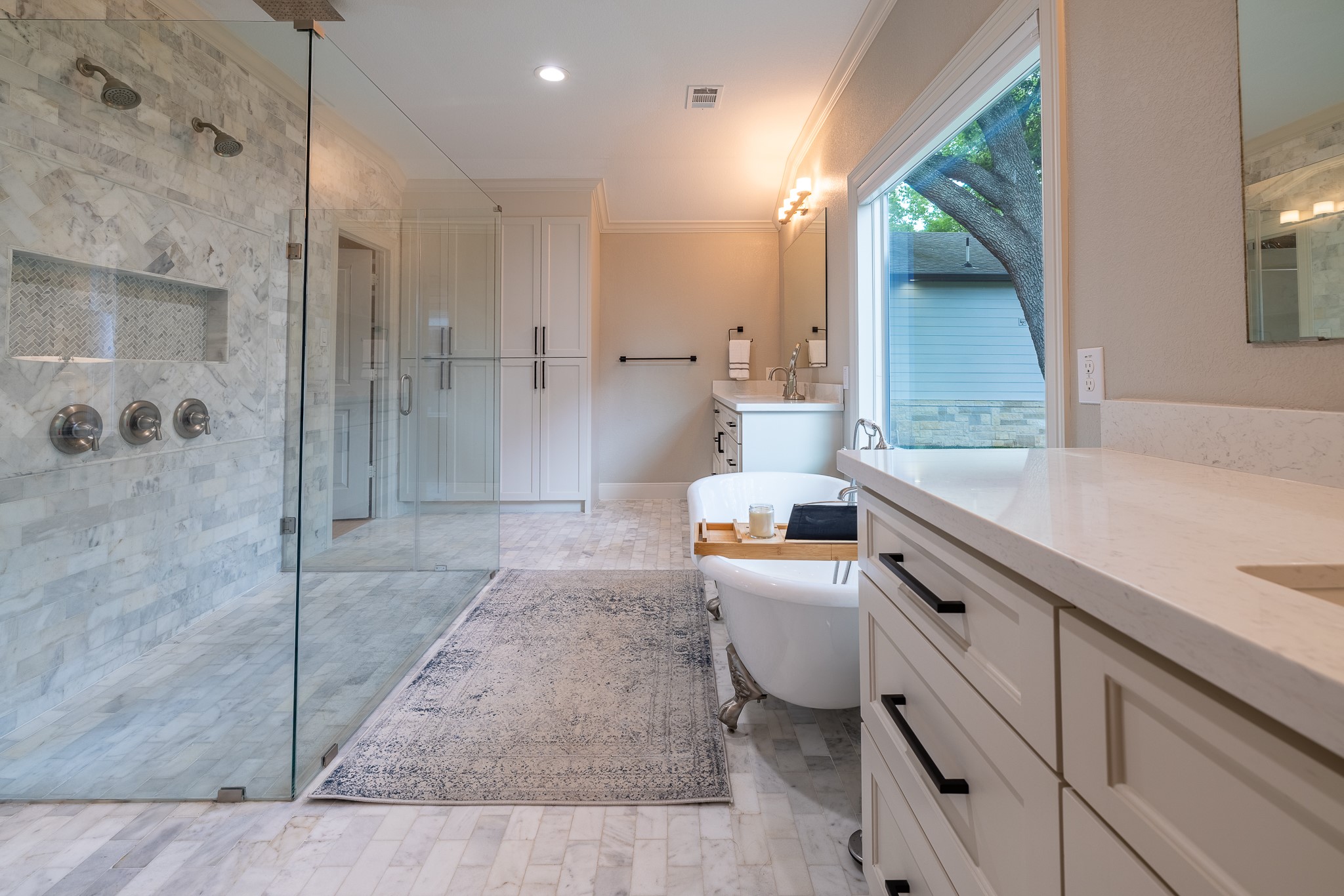 5230 Redstart Street Houston, TX 77035 - Photo 3 of 30 Primary bath shower detail — floor-to-ceiling designer tile and premium fixtures throughout