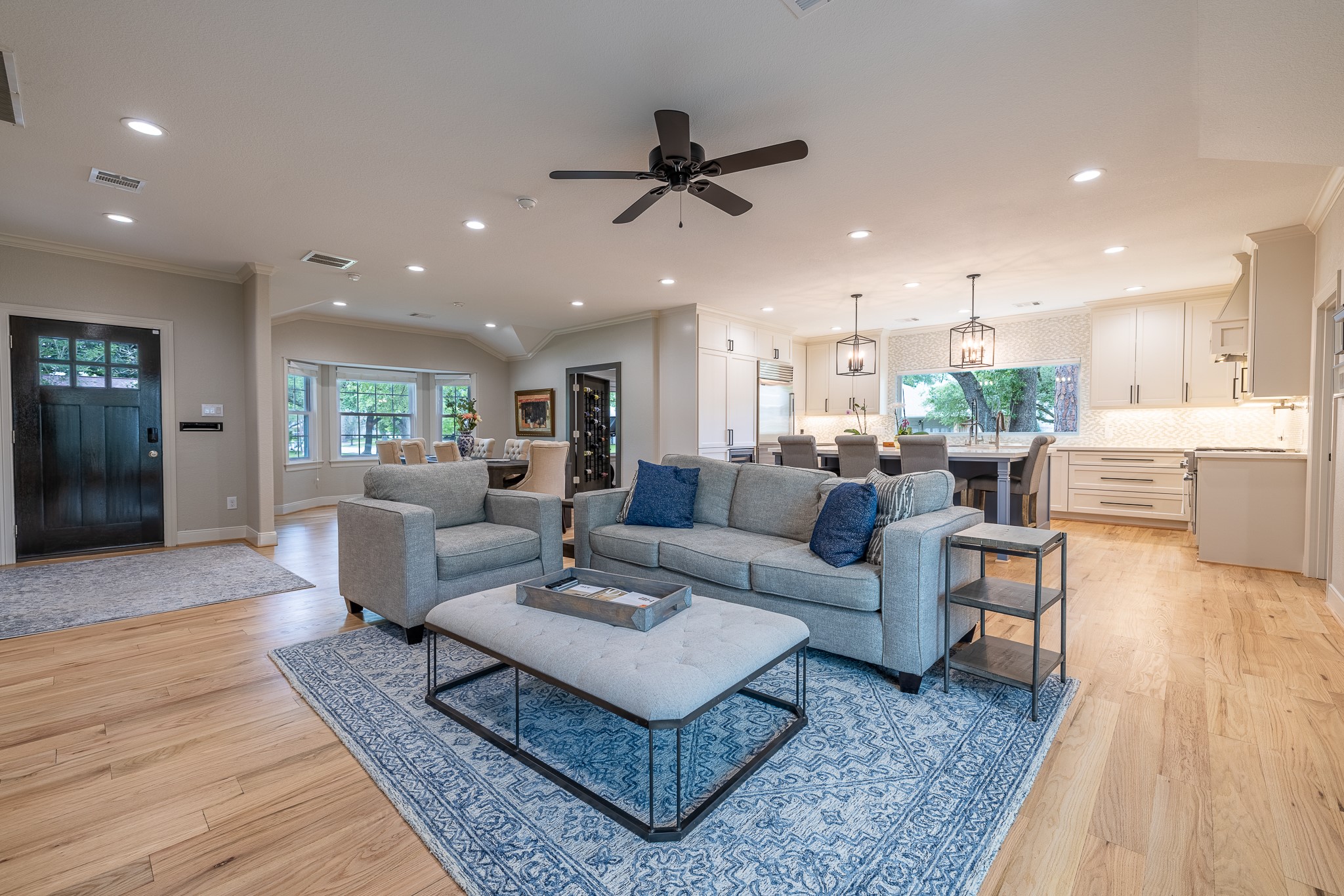 5230 Redstart Street Houston, TX 77035 - Photo 6 of 30 Spacious living area with ceiling fan, hardwood floors, and abundant natural light