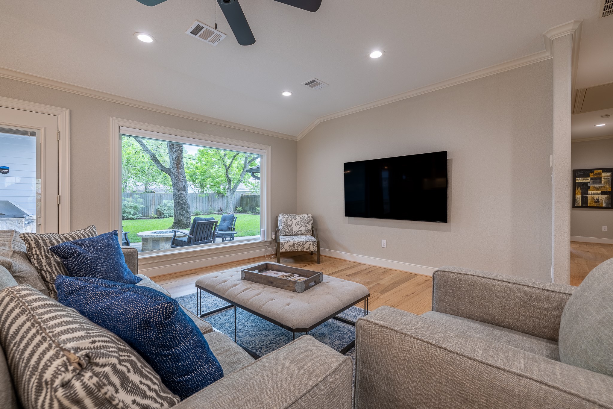 5230 Redstart Street Houston, TX 77035 - Photo 7 of 30 Living room with large windows, hardwood floors, and designer finishes — light and airy throughout
