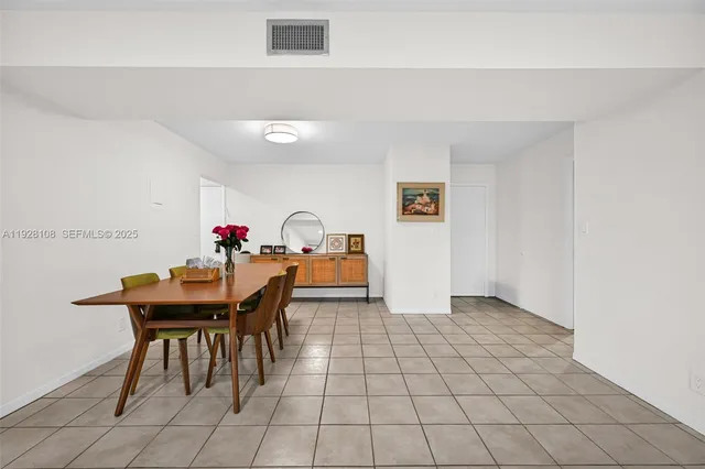 a kitchen with stainless steel appliances a refrigerator sink and microwave