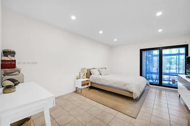 a bedroom with a bed and a table in it